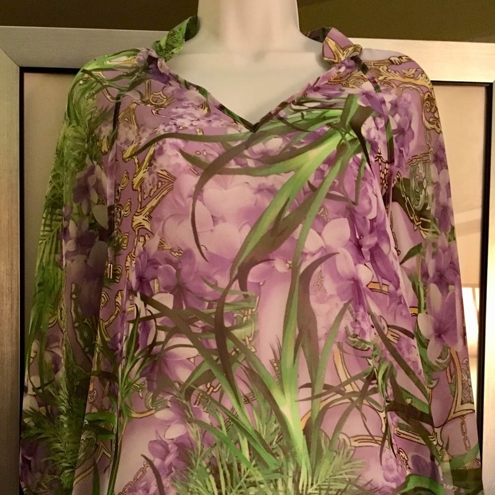 Jennifer Lopez sheer long sleeve blouse